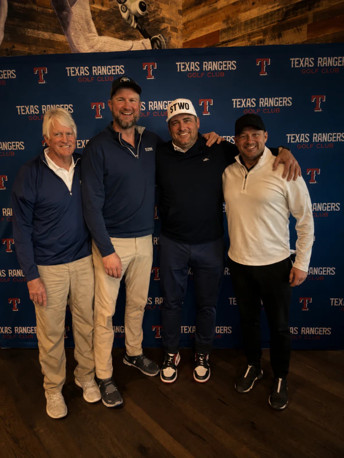 Four golfers posing at Texas Rangers Golf Club